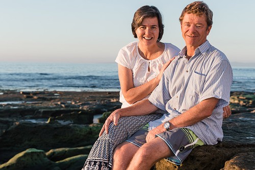 Lowell and Anne Jooste founders of LJ Crafted Wines posing at the beach