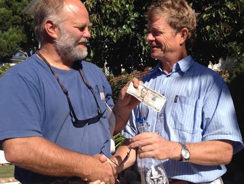 Tom buying the first bottle of LJ Crafted Wine from Lowell